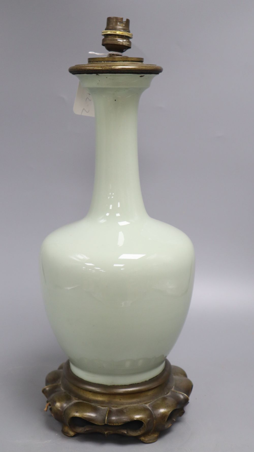 A Chinese celadon vase, mounted in bronze as a lamp, height 39cm